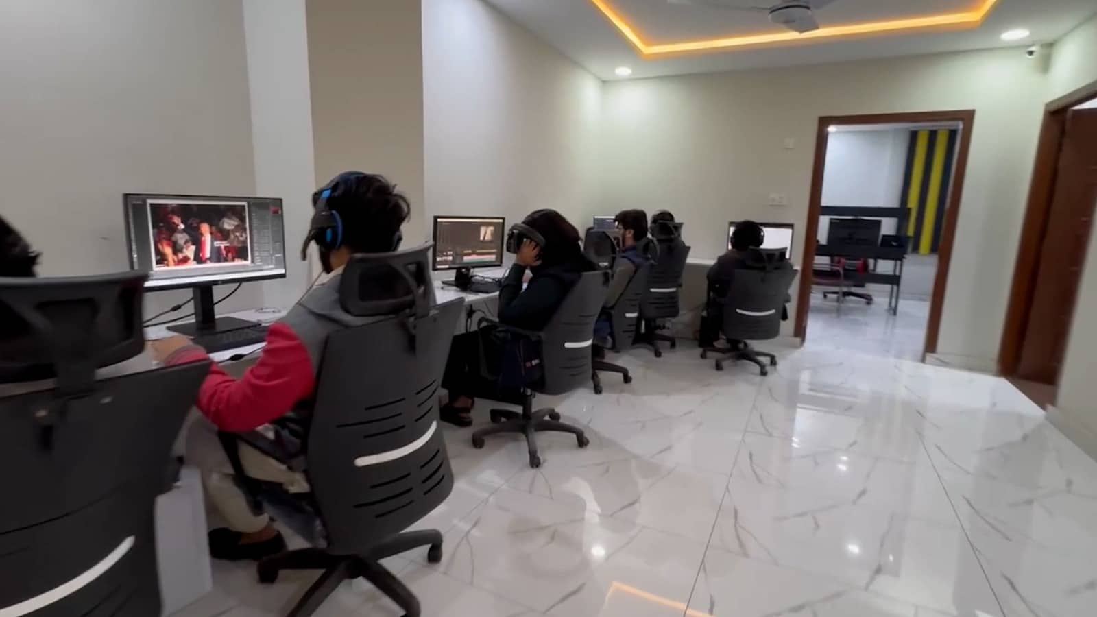 Video editors of synergy creation company setting in office and doing professional edits